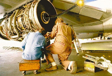 A United Airlines ground crew at New York's LaGuardia Airport is shown here lighting a 747 in preparation for takeoff. The plane exploded minutes later.